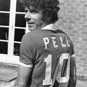 Charlie Aitken wearing a Pele football shirt. 25th May 1977