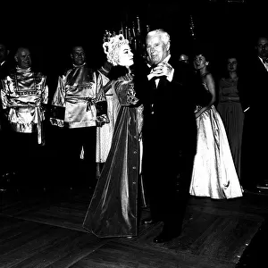 Charlie Chaplin actor dancing at the Ice Ball in Paris December 1954