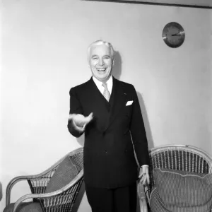 Charlie Chaplin being interviewed during his trip to the United Kingdom