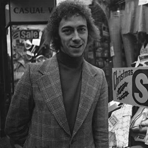 Charlie George football player of Arsenal December 1974 outside a men clothing