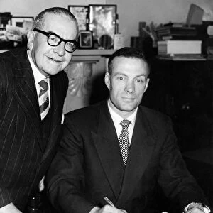 Charlie Mitten signs the agreement to become the new manager of Newcastle United watched
