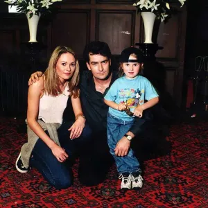 Charlie Sheen with Leandra Strand and Tyla, 1997 Print