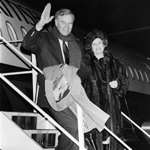 Charlton Heston arrives at Newcastle Airport, with his wife Lydia