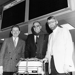 Charlton Heston arrives at Newcastle Airport, greeted by Coun Derek Watson (left