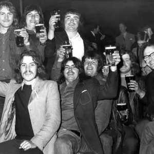 Cheers, Lads! It may be cold, it may be raining outside but these festival goers seem