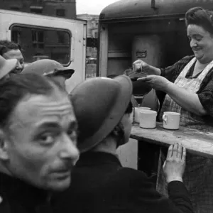 A cheery face behind a cup of tea - well earned refreshment for scores of soldiers A cheery face behind a cup of tea - well earned refreshment for scores of soldiers