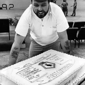 Chef, Petty Officer Bill Colmer with the cake made to commemorate HMS Liverpool Chef, Petty Officer Bill Colmer with the cake made to commemorate HMS Liverpool