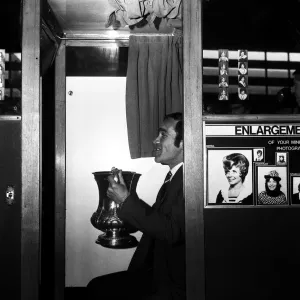 Chelsea captain Ron Harris sits in the Photo booth on Piccadilly station with the FA Cup Chelsea captain Ron Harris sits in the Photo booth on Piccadilly station with the FA Cup