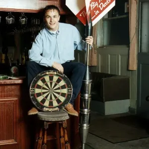 Chelsea and England footballer Dennis Wise poses in a public house with a dartboard Chelsea and England footballer Dennis Wise poses in a public house with a dartboard