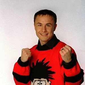Chelsea and England footballer Dennis Wise wearing a Dennis the menace jumper