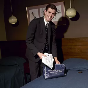 Chelsea footballer Peter Osgood in a hotel room packing his bag February 1966