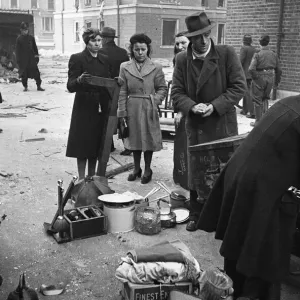 Chelsea residents with the few belonging salvaged from their bombed out following a raid Chelsea residents with the few belonging salvaged from their bombed out following a raid