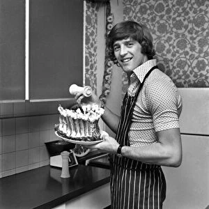 Chelsea striker Ian Hutchinson Prepares a meal for some of his team mates at his home in