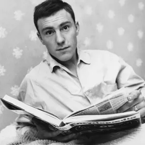 Chelsea striker Jimmy Greaves relaxing reading a book. 26th February 1960