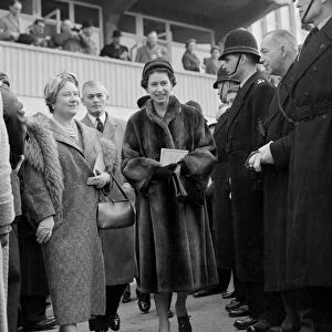 Cheltenham Festival 1956. The Queen and Queen Mother walking down to the paddock to see