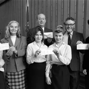 Cheques are presented to charity representatives at All Saints RC High School Cheques are presented to charity representatives at All Saints RC High School