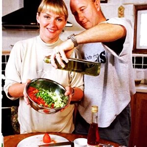 Cheryl Baker TV Presenter busy cooking in the kitchen of her house with her husband Steve