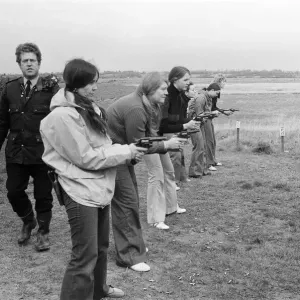 Chief Instructor, Sergeant Ivor Montgomery, training police women on the firing range Chief Instructor, Sergeant Ivor Montgomery, training police women on the firing range