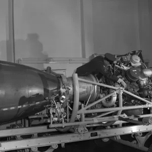 Chief Tech, Norman Clamp, of Southport, checking a Rocketdyne propulsion unit for a Thor