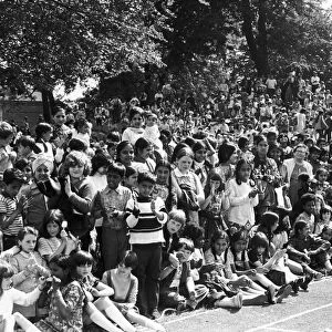 Children of all ages and backgrounds line the route of the 1973 Hillfields Carnival