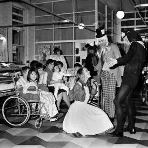Children of Booth Hall Hospital meet character from Alice in Wonderland Children of Booth Hall Hospital meet character from Alice in Wonderland
