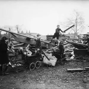 Children collecting firewood from bomb sites, Print