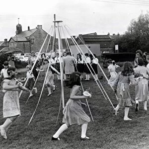 Children dancing around the maypole on the site of the car park, Cowbridge. 5th May 1981