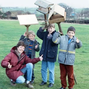 Children at Emley First School with bird tables donated to the school after an appeal in
