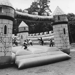 Children enjoy a bouncy castle