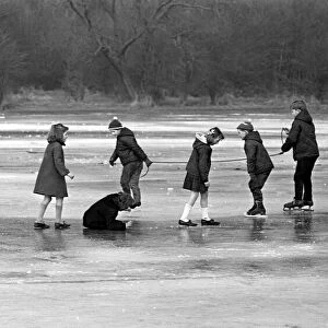 Children enjoy skating on the ice at Welchs Meadow, Leamington
