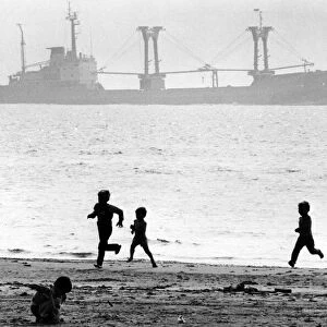Children enjoying the summer holidays on Crosby beach. Crosby, Sefton, Merseyside