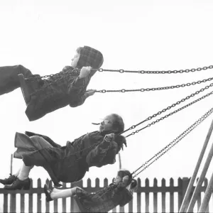 Children enjoying the swings