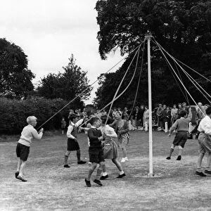 Children in the hamlet of Checkendon, Berks. doing their annual Maypole Dance