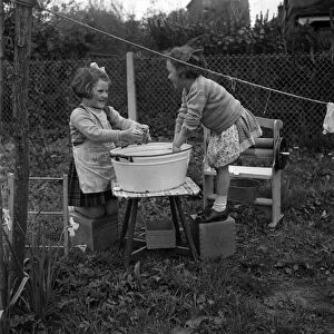 Children hanging out washing on the line in class at Cookham Nursery School