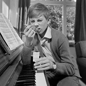 Children. Humour: Young boy at home setting at the piano. November 1969 Z11493-003