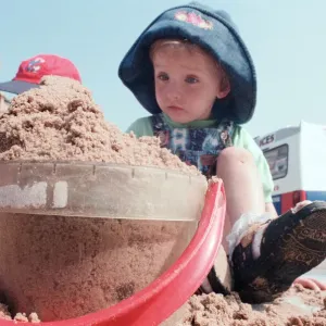 Children from Kids & Co. Nursery spend the morning playing with the sand in Children from Kids & Co. Nursery spend the morning playing with the sand in