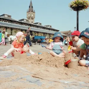 Children from Kids & Co. Nursery spend the morning playing with the sand in Children from Kids & Co. Nursery spend the morning playing with the sand in