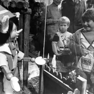 Children meet Pinocchio through the window of the Fenwick store in Newcastle Children meet Pinocchio through the window of the Fenwick store in Newcastle