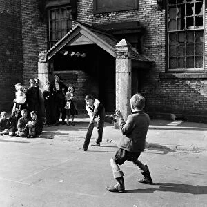 Children playing cricket in a back street in Sunderland