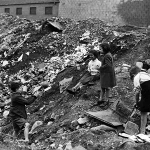 Children playing on a dump near Harrowby Street, Cardiff Docks Children playing on a dump near Harrowby Street, Cardiff Docks