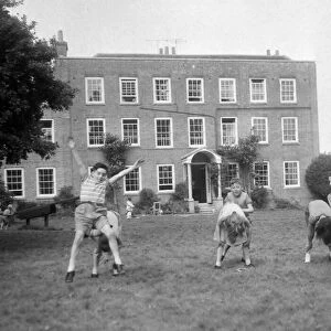 Children playing Leapfrog in the gardens at Beech Hill House convalescent home