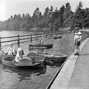 Children playing on paddle boats in Sutton Park