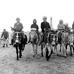 Children riding donkeys along the beach at Blackpool 5th August 1958