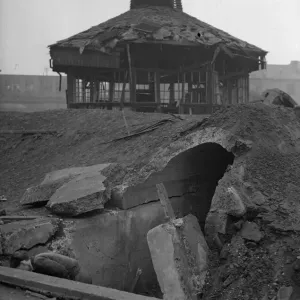 Children search a crater for shrapnel following near miss to a public shelter in Aston Children search a crater for shrapnel following near miss to a public shelter in Aston