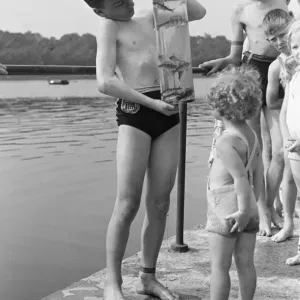 Children seen here with their days catch in a jar on the banks of the River Lea