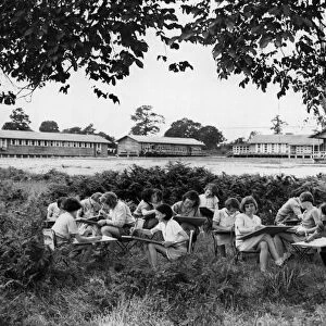 Children sketching in part of 35 acres of ground attached to a camp in the West Midlands