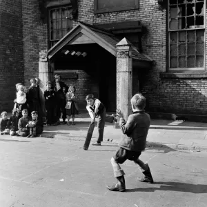 Children of Sunderland playing cricket in the back streets. 28th April 1954 Children of Sunderland playing cricket in the back streets. 28th April 1954