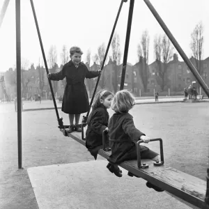 Children on the swings at Paddington recreation grounds. 30th March 1954 Children on the swings at Paddington recreation grounds. 30th March 1954