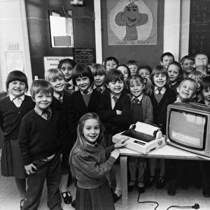 Children using computers. Teacher Heather Sedgwick and her band of happy pupils at