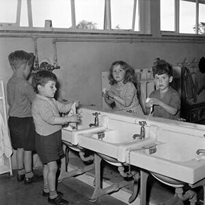Children washing their hands before class at Cookham Nursery School